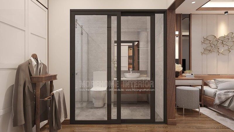 Bạn đang băn khoăn với ý tưởng bố trí phòng ngủ nam khép kín khi sử dụng gỗ óc chó làm vật liệu chủ đạo phòng ngủ thì phòng tắm nên trang trí như nào cho hợp lý mà vẫn giữ nguyên vẻ đẹp sang trọng đó. Ý tưởng thiết kế phòng tắm cửa kính trượt viền đen kết hợp không gian màu xám từ gạch ốp giả bê tông cùng tủ đựng đồ phòng tắm bề mặt đá vân mây với lớp cánh gỗ óc chó sẽ là gợi ý khá độc đáo trong căn hộ chung cư, nhà phố, nhà liền kề, biệt thự.